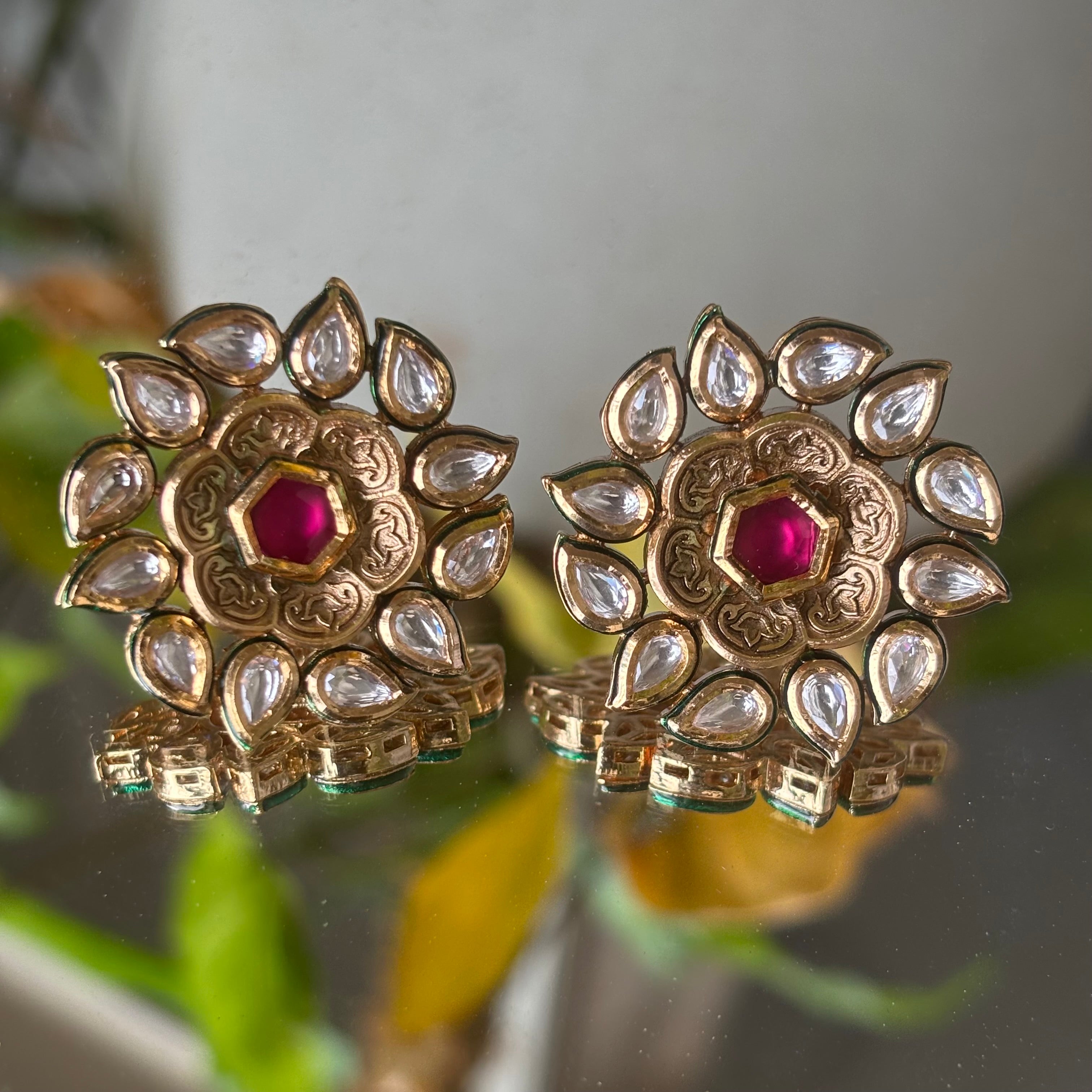 Ruby and uncut diamond studs in floral motif with gold base and vintage-inspired finish